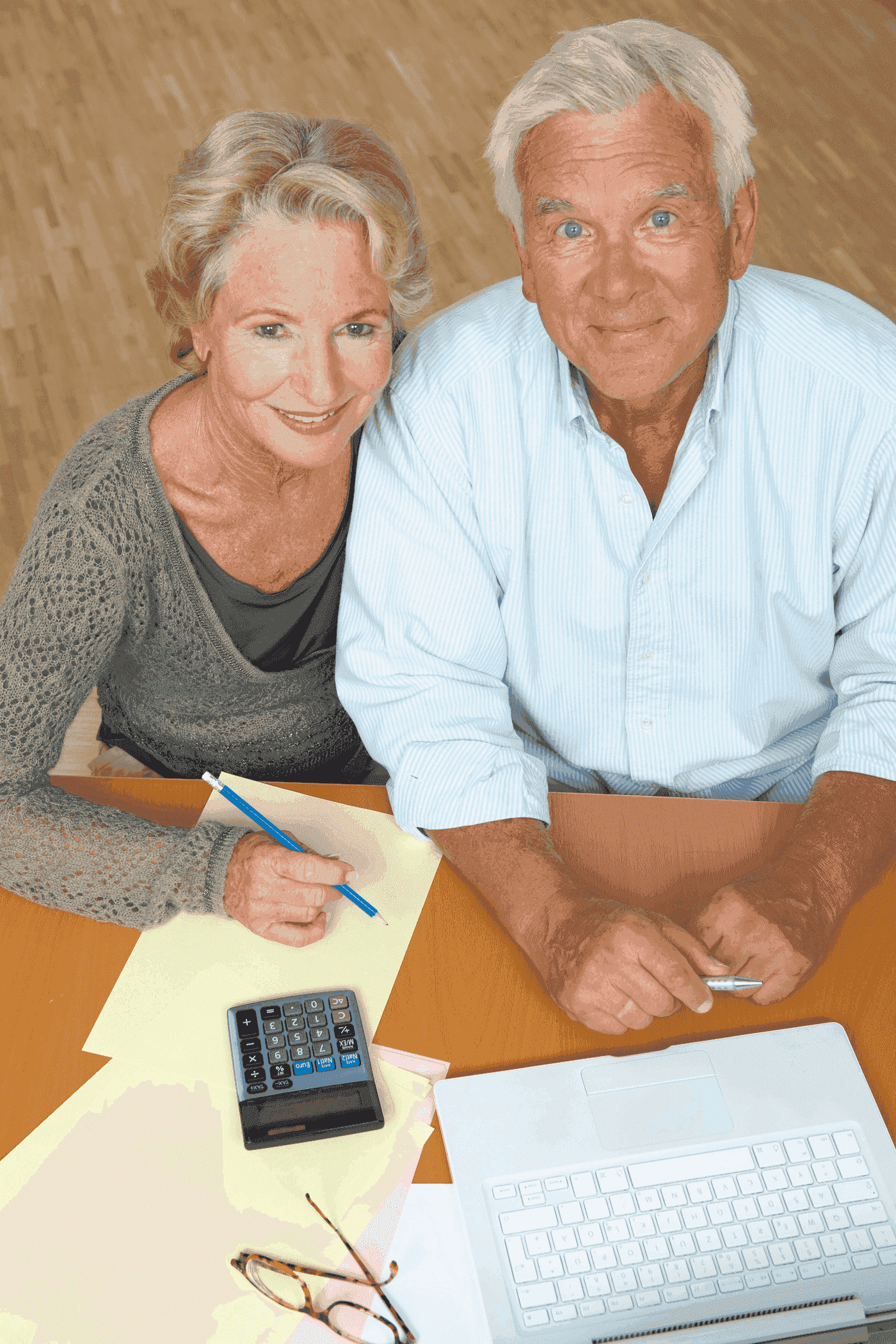 An older Utah couple reviewing Medicaid long-term care paperwork together.